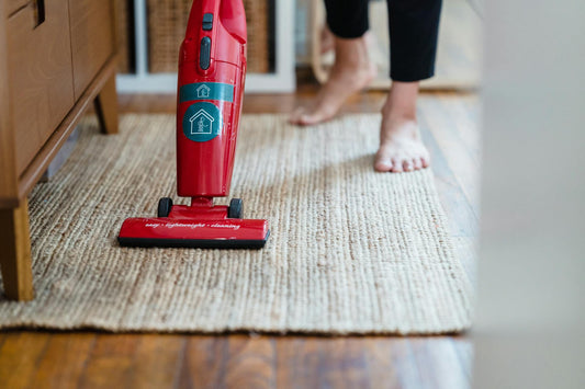 Man cleaning floor with vacuum cleaner
